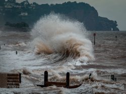 sea waves crashing on shore during daytime