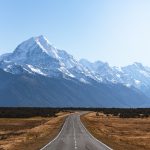 mountains covered with snow near road